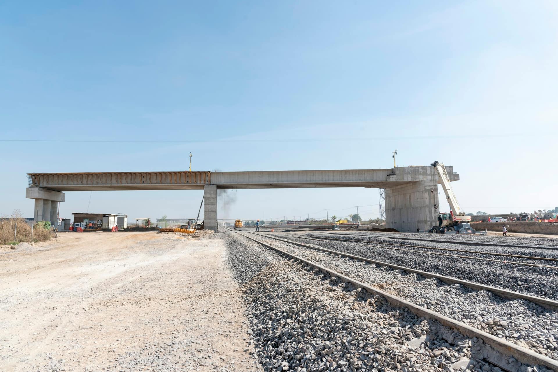 Elevated road deck and rail crossing on a completed section