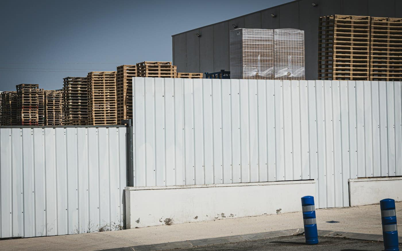 Warehouse with white cladding and loading area