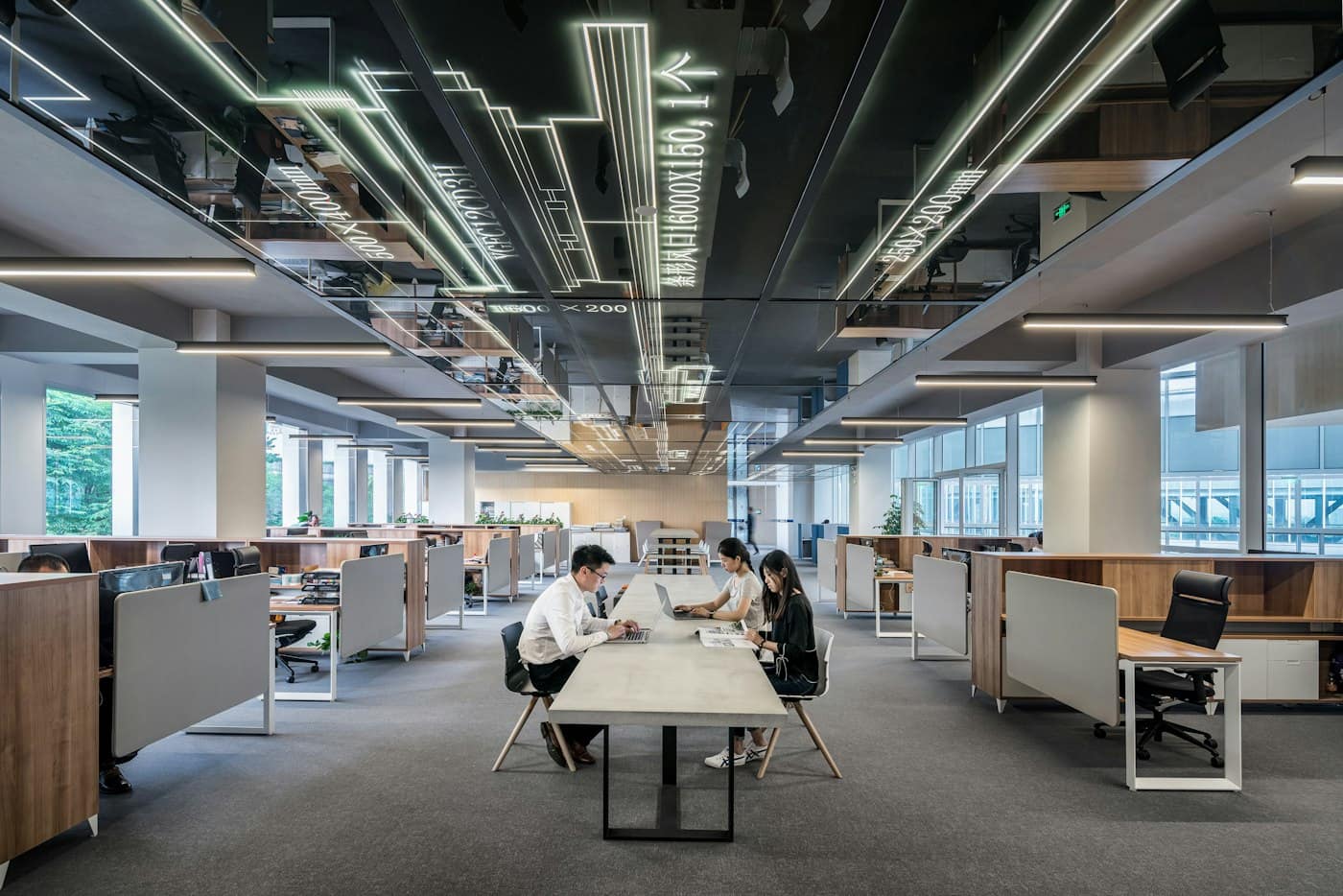 Open-plan office floor with exposed services overhead