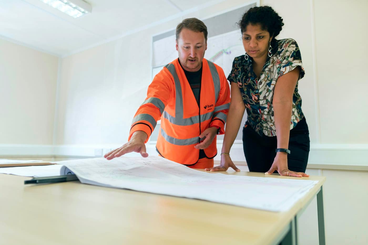 engineers reviewing drawings on site