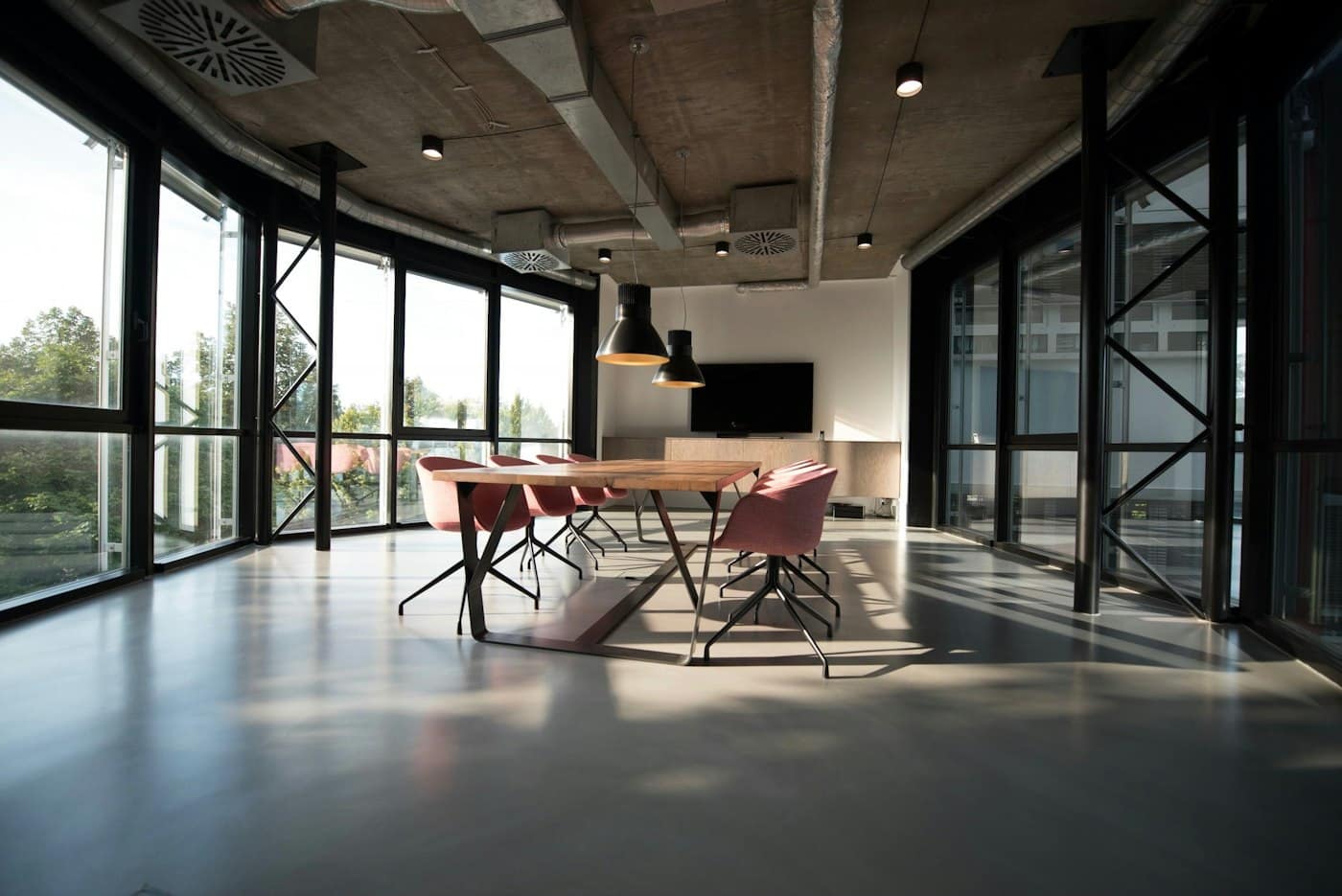 Finished loft-style office floor with floor-to-ceiling glazing